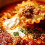 A close-up of Italian Lasagna Soup with rich tomato broth, ground beef, lasagna noodles, melted cheese, and fresh herbs, served hot in a bowl.