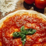 Bowl of easy homemade pizza sauce with fresh ingredients