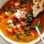 Bowl of delicious Mediterranean soup with fresh vegetables and spices