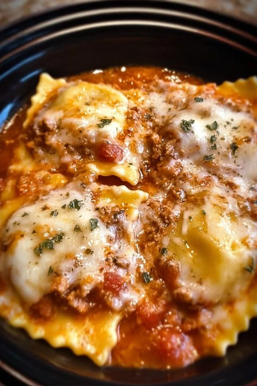 Crockpot Ravioli Lasagna bubbling in a slow cooker, perfect comfort dish.