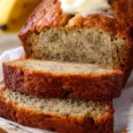 Slice of easy moist banana bread on a white plate.