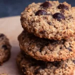 Homemade oatmeal protein cookies on a baking sheet, healthy snack option.