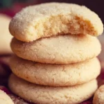 Soft and chewy sugar cookies on a plate, decorated with sprinkles