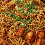 Sticky Garlic Chicken Noodles with vibrant vegetables and savory sauce