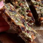 A variety of superfood granola bars with nuts and fruits for a healthy snack.