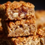 Freshly baked Banana Oatmeal Bars on a wooden table