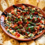 Delicious bruschetta dip served with crispy bread for dipping.