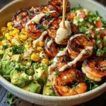 Grilled shrimp bowl with avocado, corn salsa, and creamy garlic sauce