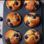 Hearty blueberry protein muffins with fresh blueberries