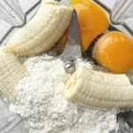 stack of fluffy high protein pancakes topped with fresh berries and syrup