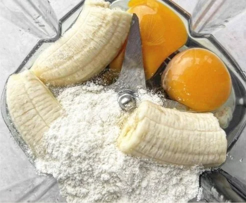 stack of fluffy high protein pancakes topped with fresh berries and syrup