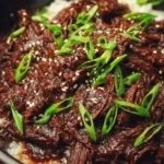 Delicious slow cooker Korean beef served over rice with vegetables