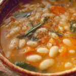 Bowl of homemade white bean soup garnished with herbs and spices