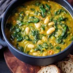 Bowl of healthy spinach, lentil, and butter bean vegan soup
